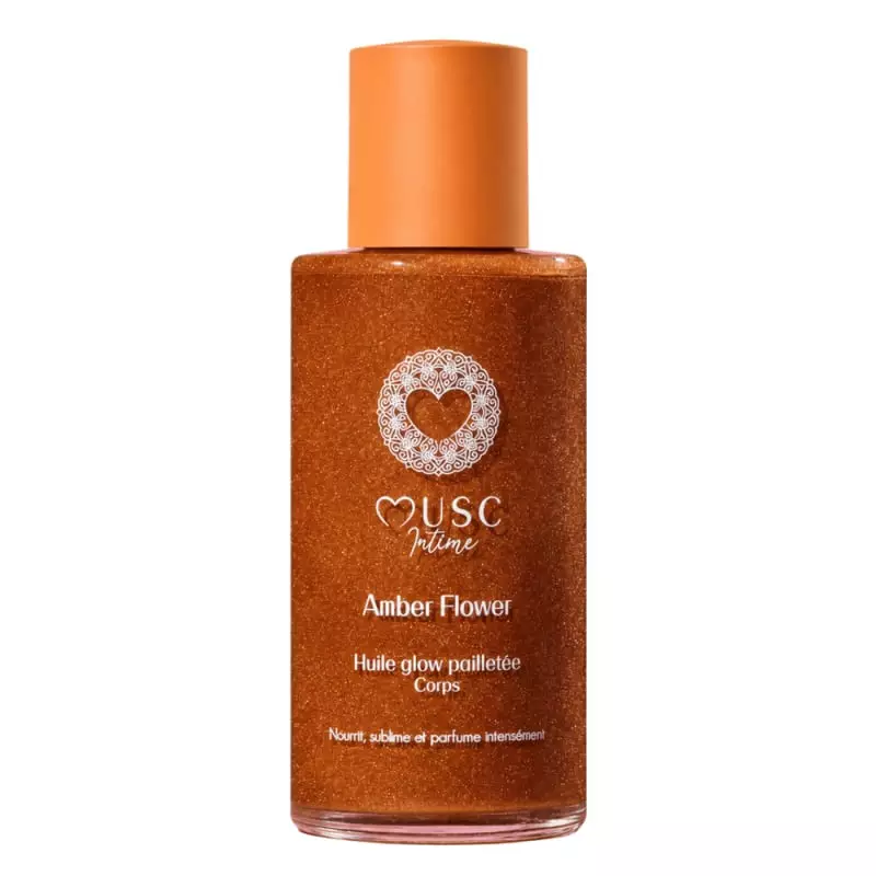 Flacon de l'huile glow pailletée Musc Intime Amber Flower, 100ml, avec une texture dorée et scintill