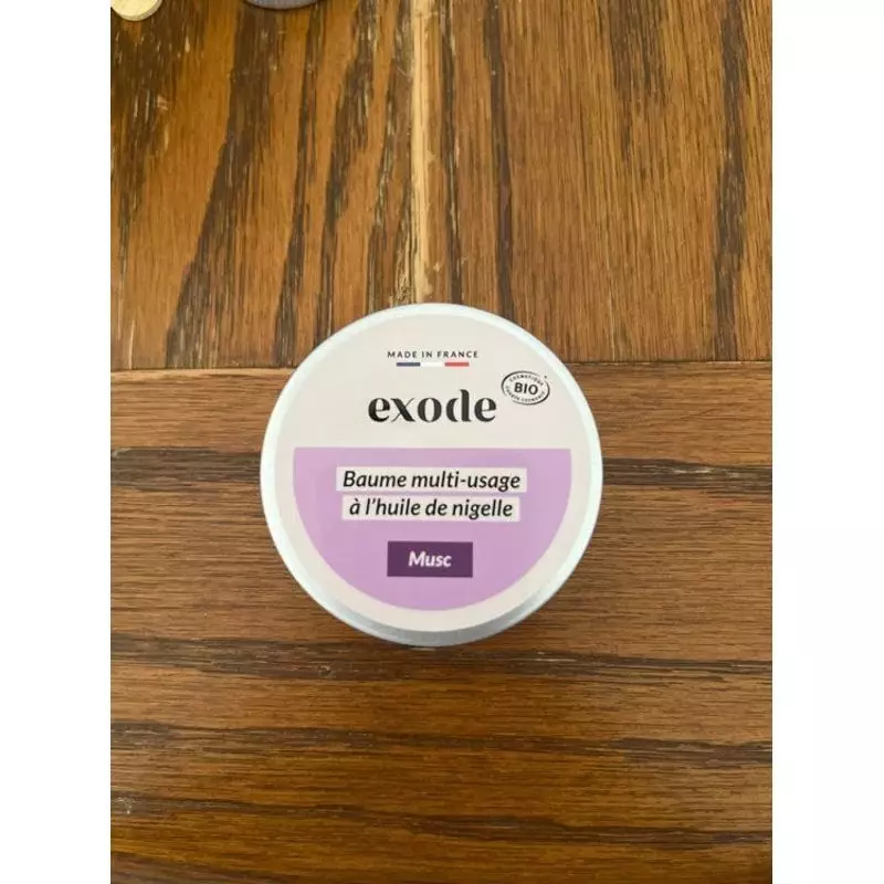 Exode Baume Multi-Usage Musc 50g en boîte sur surface bois, étiquette rose-violette, marque Exode, F