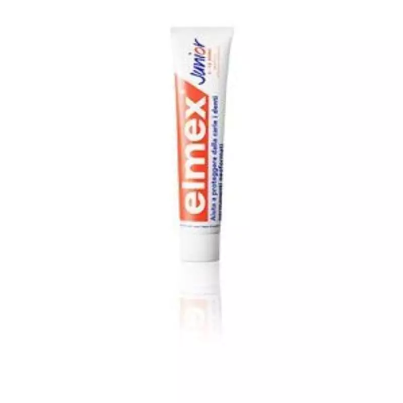 Gros plan sur tube de dentifrice Elmex Junior Anti-Caries Professionnel 75 ml, branding orange et bl