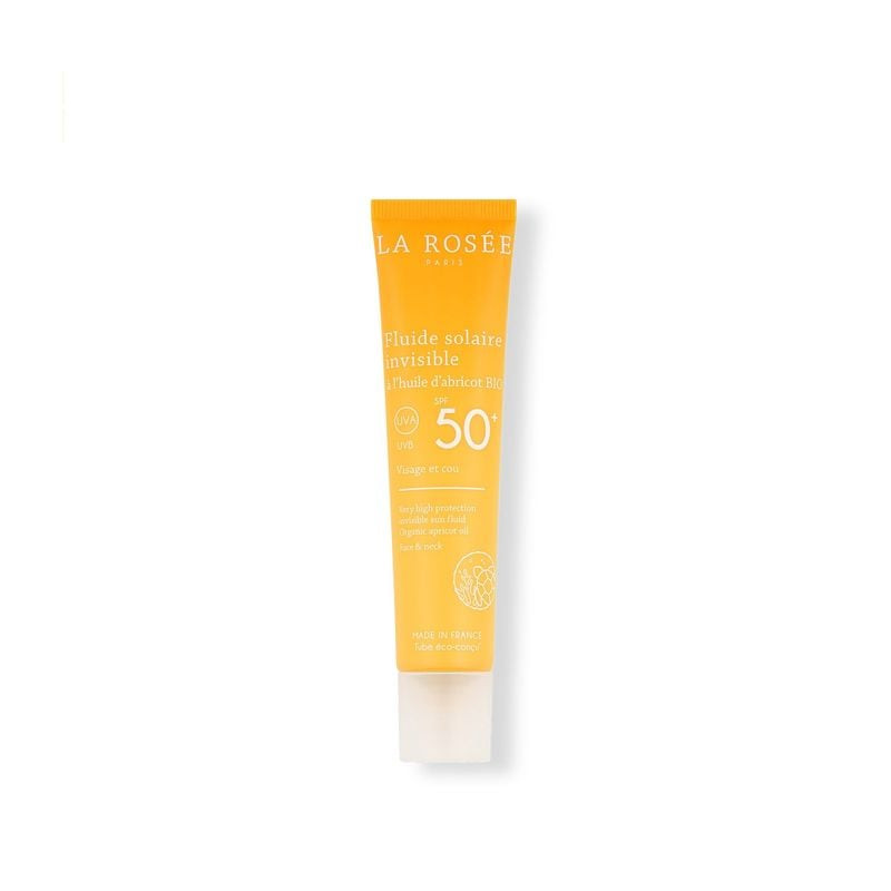 Tube de La Rosée Fluide Solaire Invisible SPF 50+ vu de dessus et de côté sur fond blanc, mettant en