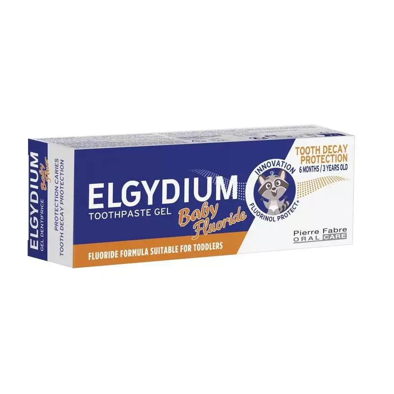 Boîte de dentifrice gel ELGYDIUM Baby Fluor, vue avant et côté, emballage bleu avec mascotte raton l