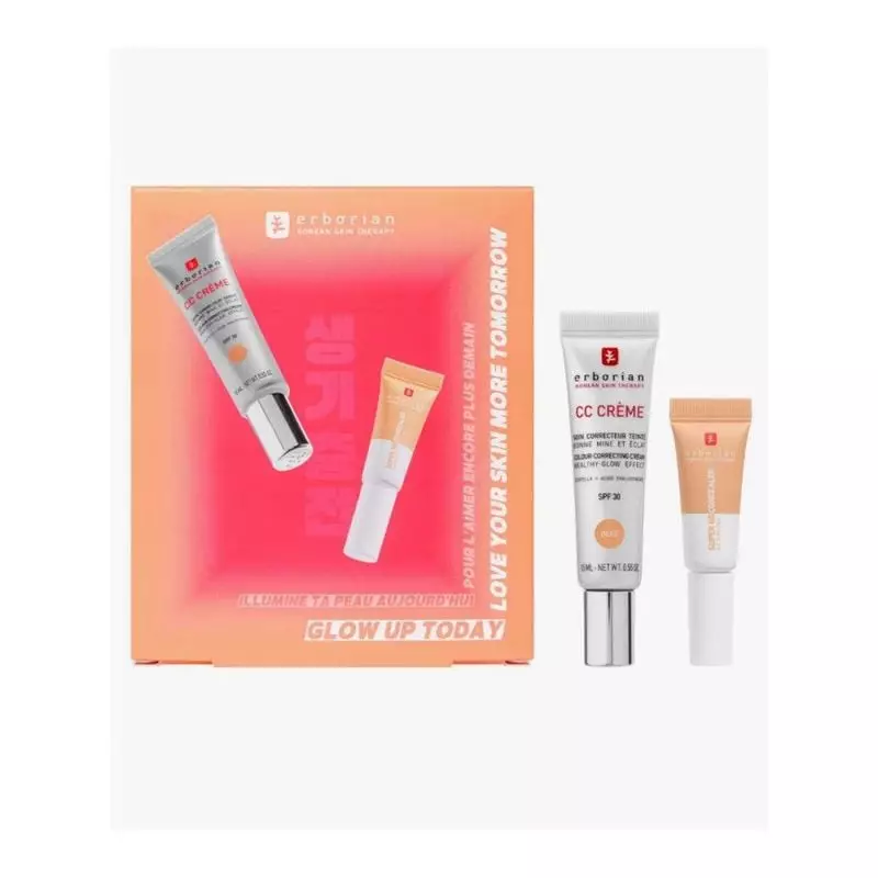 Gros plan sur la boîte Erborian avec tubes CC Crème et correcteur sur fond rose 'Glow Up Today' et é