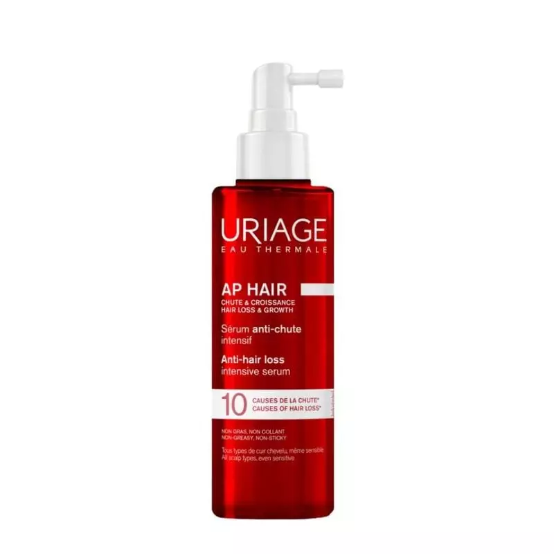 Flacon du sérum anti-chute Uriage AP+ HAIR avec applicateur pompe blanc et étiquette rouge.
