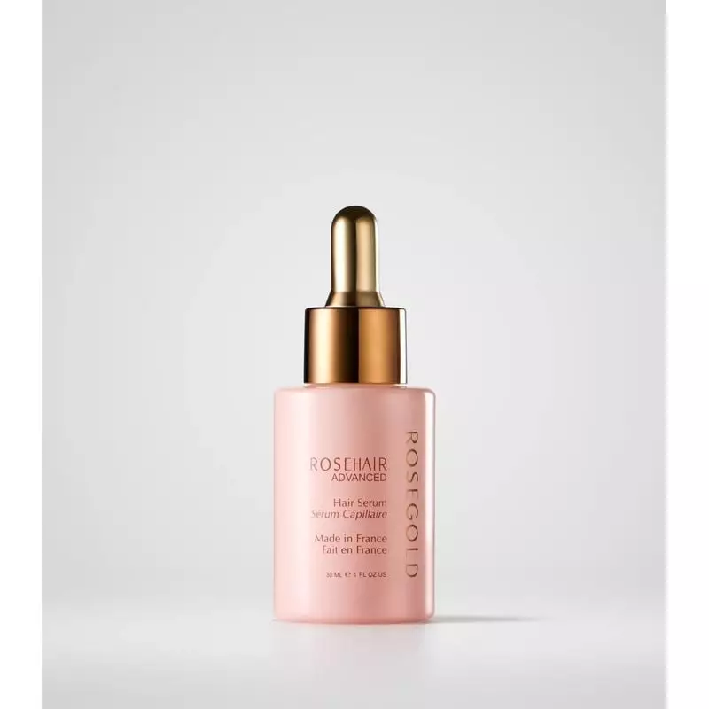 ROSEGOLD Paris ROSEHAIR Sérum capillaire avancé en flacon rose avec pipette dorée.