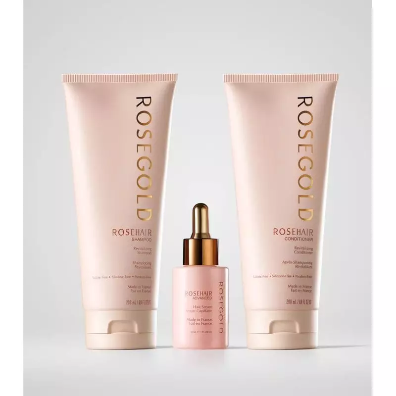 ROSEGOLD Paris bouteilles de shampoing et après-shampoing ROSEHAIR avec le sérum.