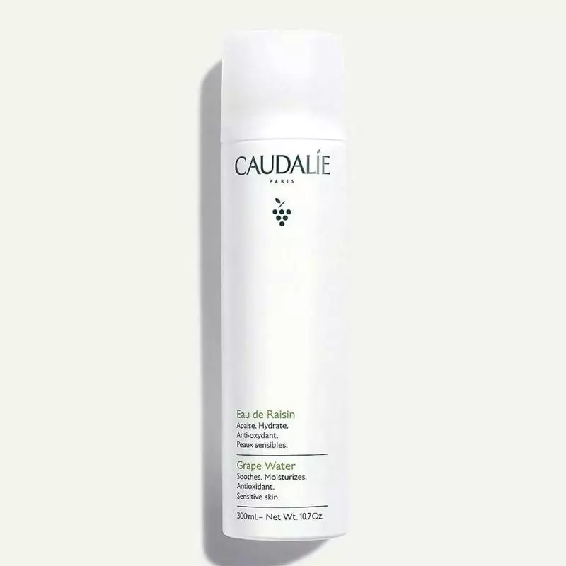 Flacon de brume hydratante visage Caudalie L'Eau de Raisin, 300 ml, packshot sur fond blanc.