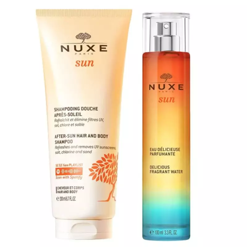 Gros plan du flacon Nuxe Sun Eau Délicieuse Parfumante avec un liquide doré et un motif floral.