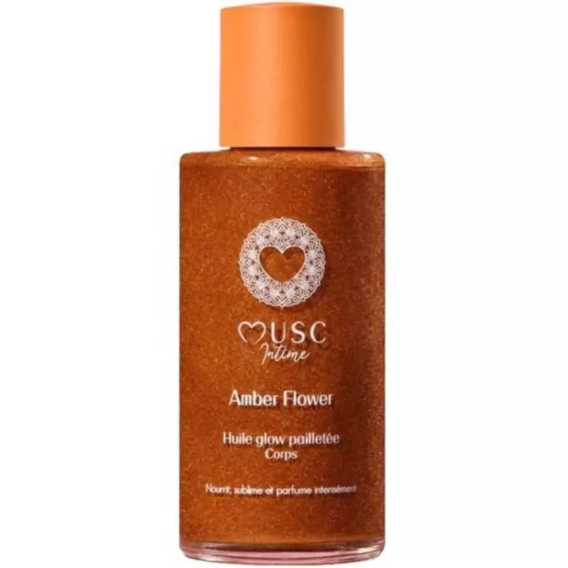 Packshot du flacon Musc Intime Huile Glow Pailletée Amber Flower 100ml, huile sèche nacrée or bronze
