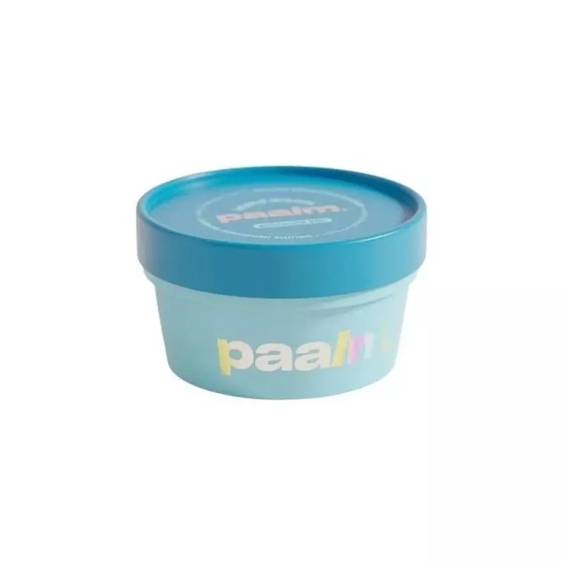 Packshot du baume déodorant Paalm Island Dream dans un pot blanc avec un design tropical.
