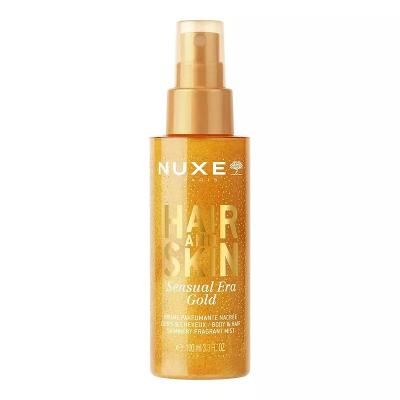 Flacon de brume parfumée corps et cheveux NUXE Sensual Era Gold avec liquide doré chatoyant.