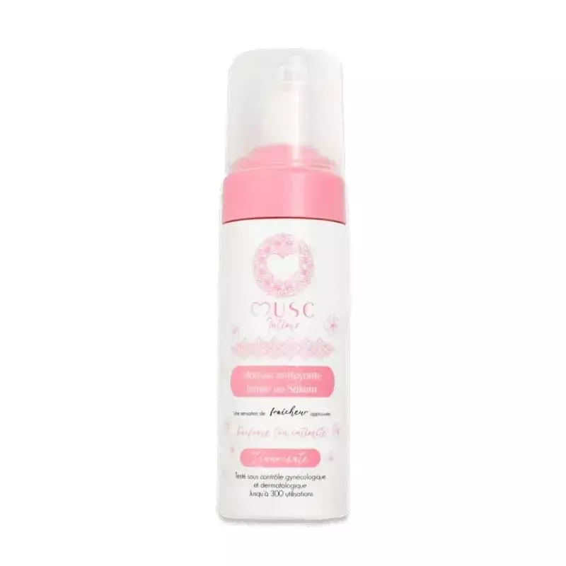 Flacon de mousse nettoyante intime Musc Intime Sakura avec motif de fleur de cerisier sur fond rose 