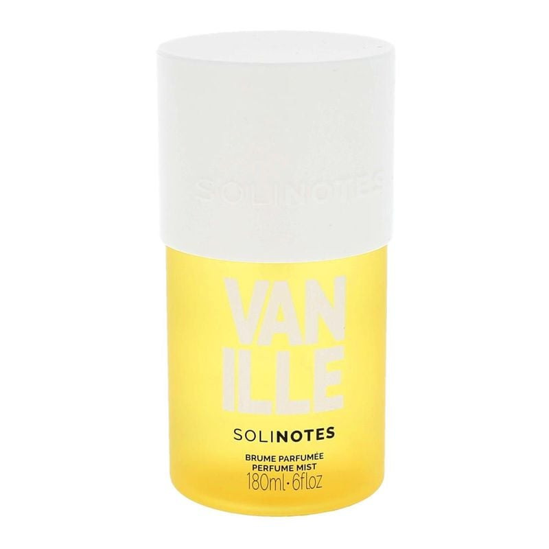 Brume parfumée Vanille Solinotes dans un flacon transparent avec un capuchon argenté, sur fond rose 
