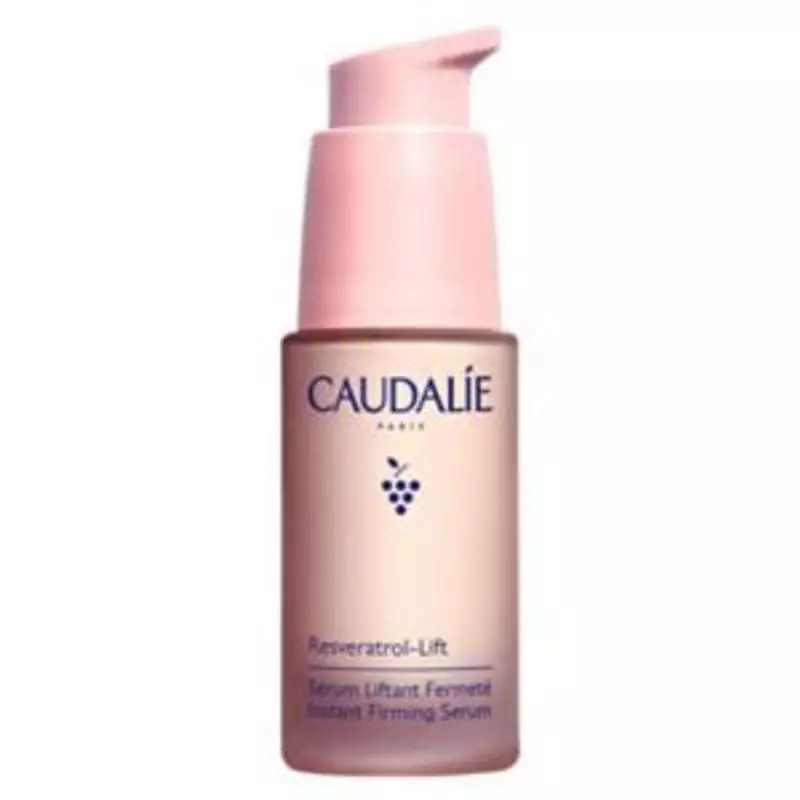 Sérum raffermissant Caudalie Resveratrol-Lift 30 ml, flacon en verre dégradé rose avec pompe distrib