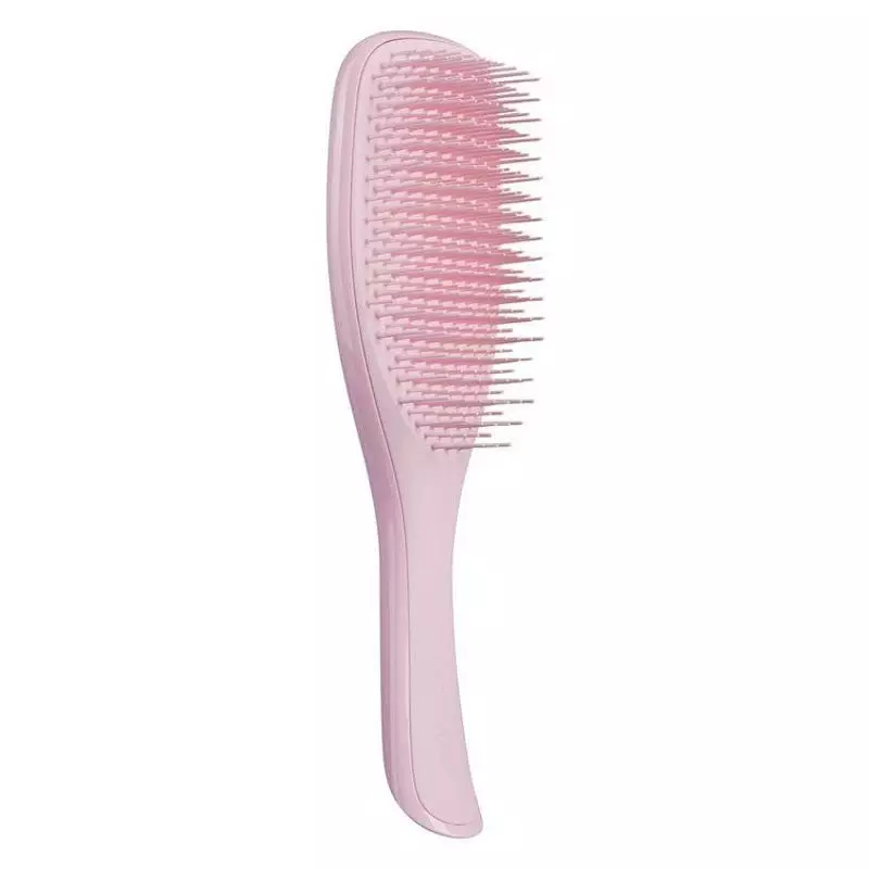 Profil latéral de la brosse démêlante Tangle Teezer rose millennial et ses picots flexibles à deux n