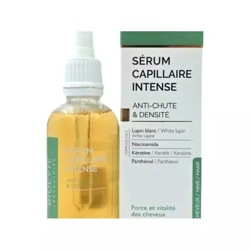 Flacon de sérum anti-chute Biocyte avec pipette à côté de sa boîte, mettant en avant lupin, niacinam