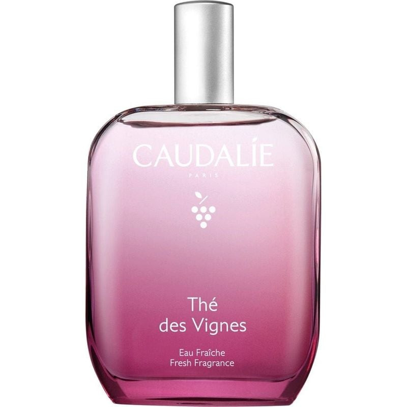 Vue de face du flacon Eau Fraîche Thé des Vignes 50 ml de Caudalie, verre dégradé rose et capot vapo