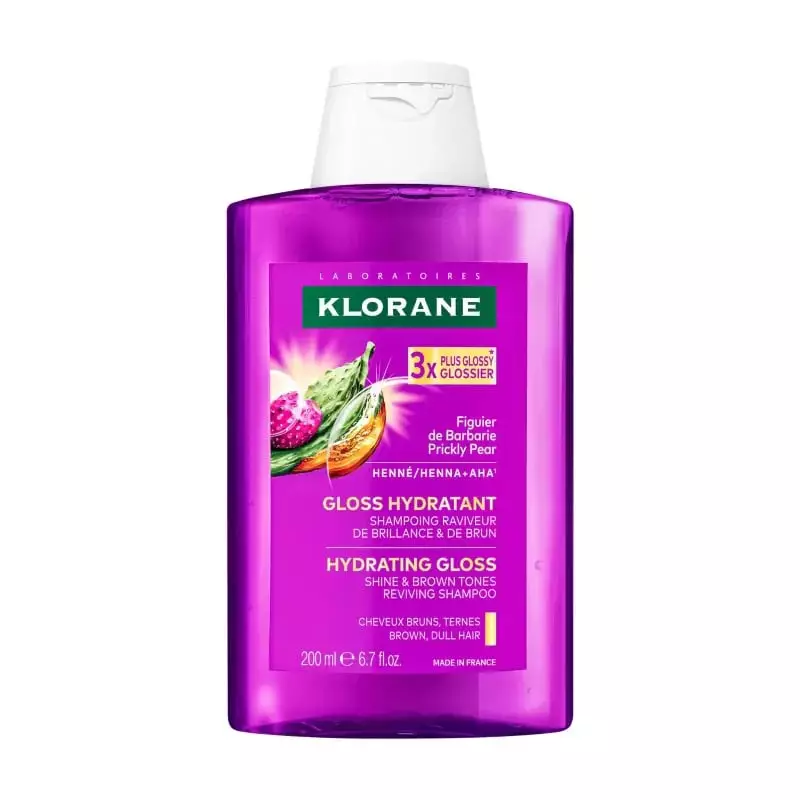 Flacon de shampoing Klorane Gloss Hydratant violet avec bouchon blanc, figuier de Barbarie et henné 