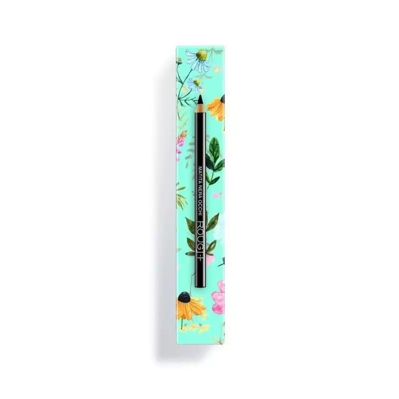 Crayon noir pour les yeux en bois posé sur une boîte Rougj florale vert menthe, pointe taillée visib