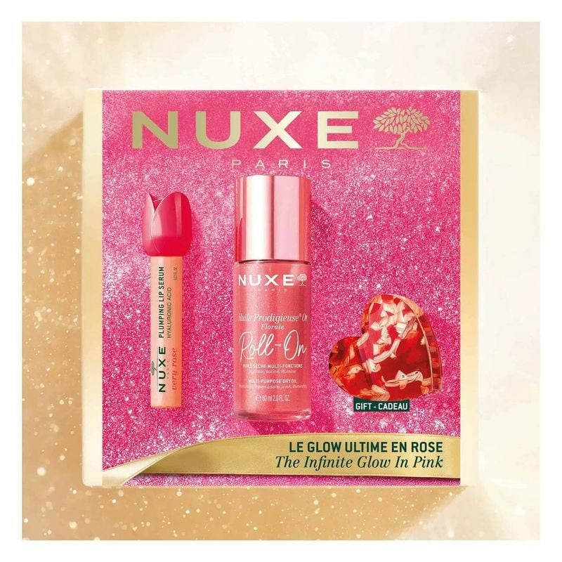 Coffret Nuxe Le Glow Ultime en Rose dans une boîte rose scintillante avec huile roll-on, sérum lèvre