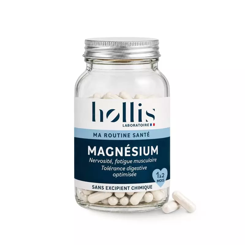 Pot en verre Hollis Magnésium de 60 gélules avec étiquette bleue et deux gélules à côté