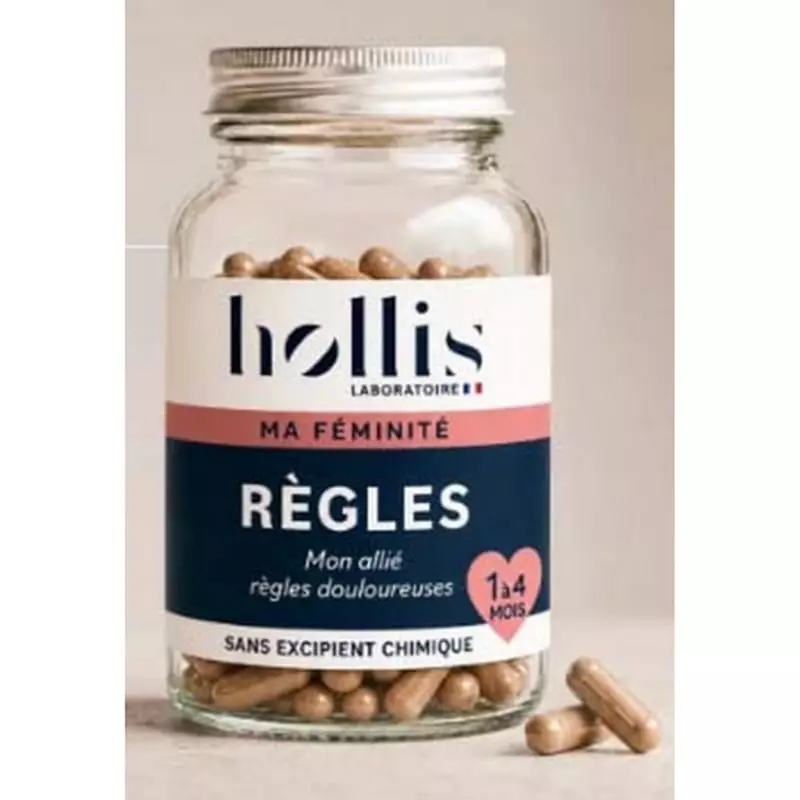 Flacon Hollis Règles sur fond beige, étiquette Ma Féminité mentionnant « règles douloureuses », deux