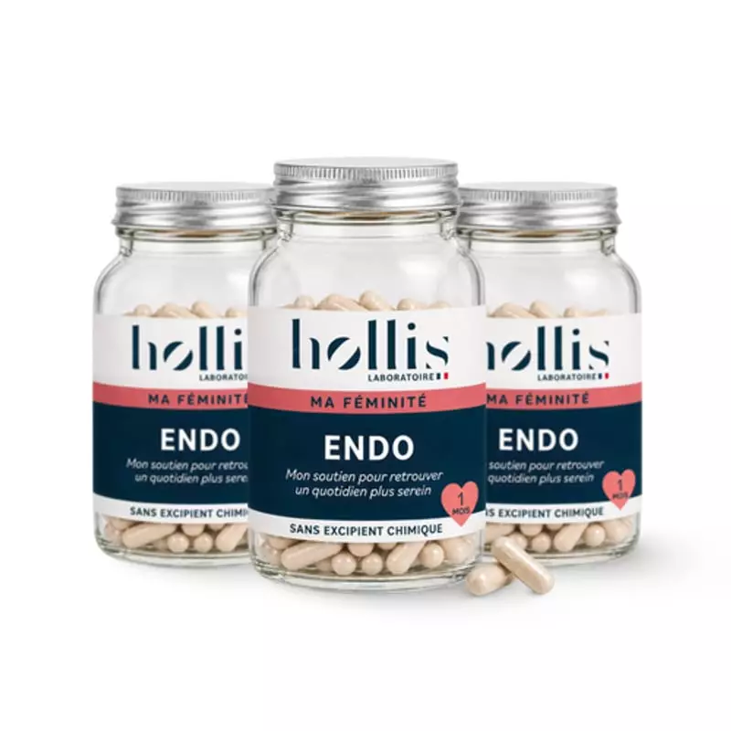 Trois pots d'Endo 90 gélules du Laboratoire Hollis avec des gélules beiges éparpillées devant