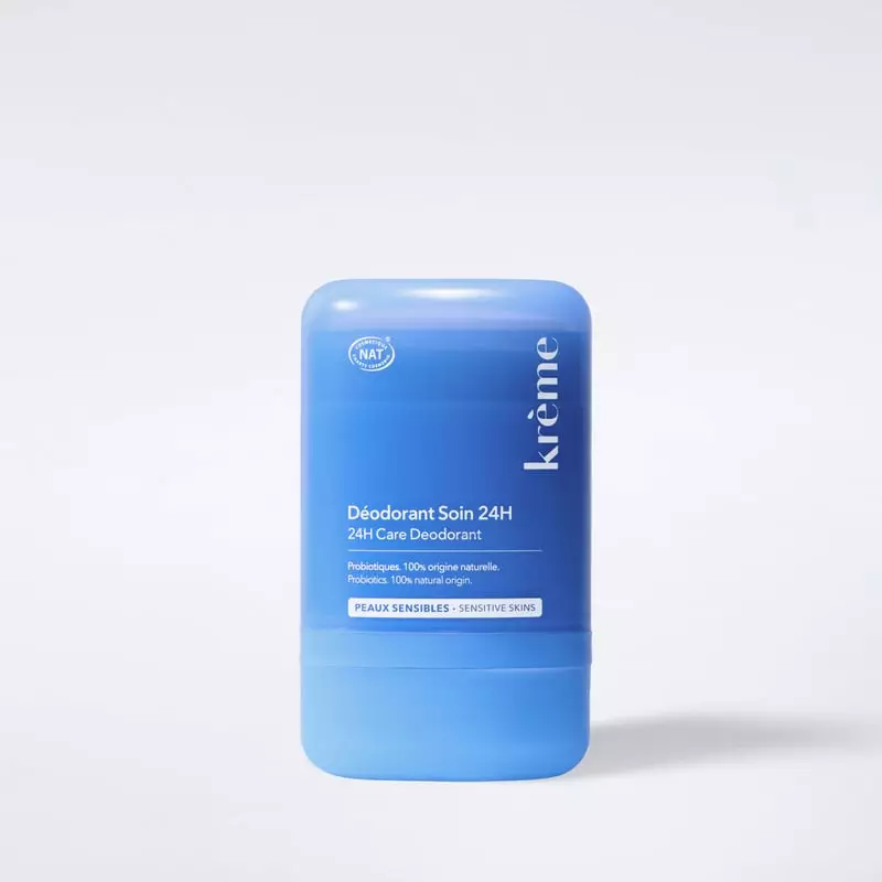 Déodorant soin 24 h Krème 50 g, stick crème bleu pour peaux sensibles, étiquette de face sur fond bl