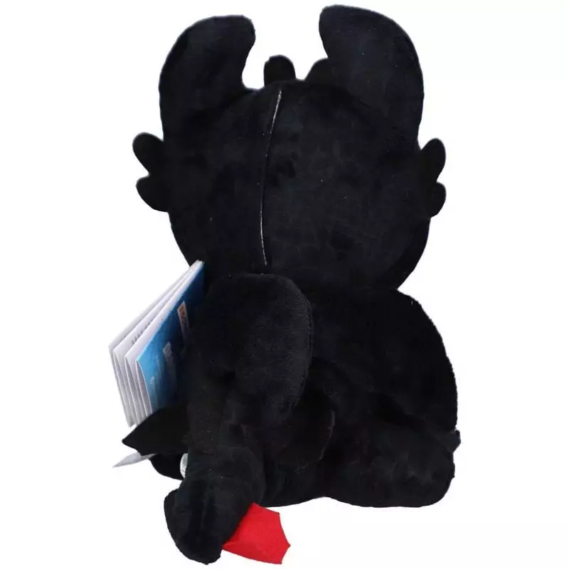 Vue arrière de la peluche Krokmou noire montrant la couture dorsale, les ailes et un petit détail ro